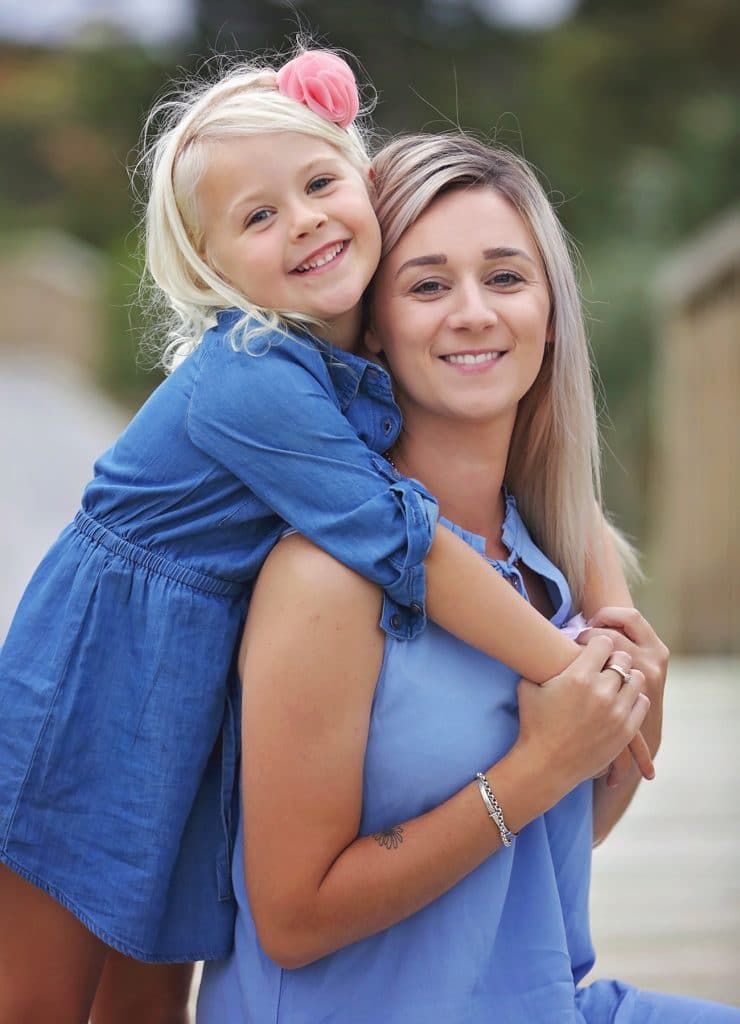 a portrait of mother and daughter having a cuddle captured by Tauranga children and family photographer Susanna